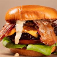 Remy'S Bacon Cheeseburger · Premium short rib burger with American Cheese, Bacon, Caramelized onions Lettuce and tomato,...