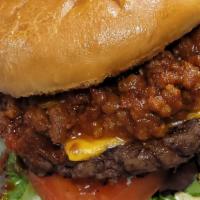 Cutter'S Chili Burger · Premium  short rib burger topped with onion rings, American cheese, homemade chilli, and ser...
