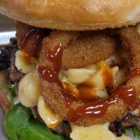 Backyard Bbq Burger · Premium  short rib burger topped with macaroni and cheese, tomato, lettuce, onion rings and ...