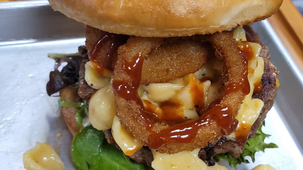 Backyard Bbq Burger · Premium  short rib burger topped with macaroni and cheese, tomato, lettuce, onion rings and BBQ sauce.