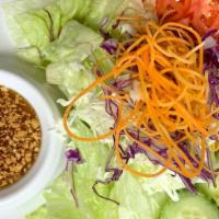 Green Salad · Lettuce, cucumber, carrot and red cabbage with ginger dressing.