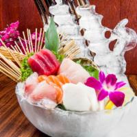 Sashimi Deluxe · 16 pieces of assorted sashimi served with white rice. Served with miso soup or salad.