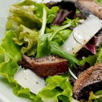 Grilled Portobello Mushroom Salad · Served over mesclun greens with mustard vinaigrette dressing.