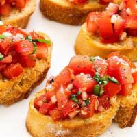 Bruschetta · Our bread , toasted and topped with chopped tomato, onion, basil, garlic and olive oil.