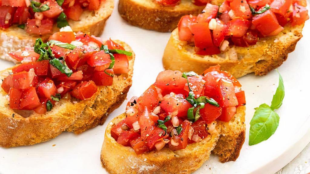 Bruschetta · Our bread , toasted and topped with chopped tomato, onion, basil, garlic and olive oil.