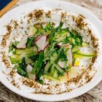 Labneh · Small Arabic strained yogurt topped with persian cucumber, radish, mint, olive oil and zahta...