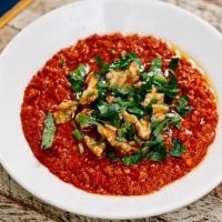 Muhammara · Small roasted red pepper spread with walnut and pomegranate.  Served with 1 pita.. *It's glu...