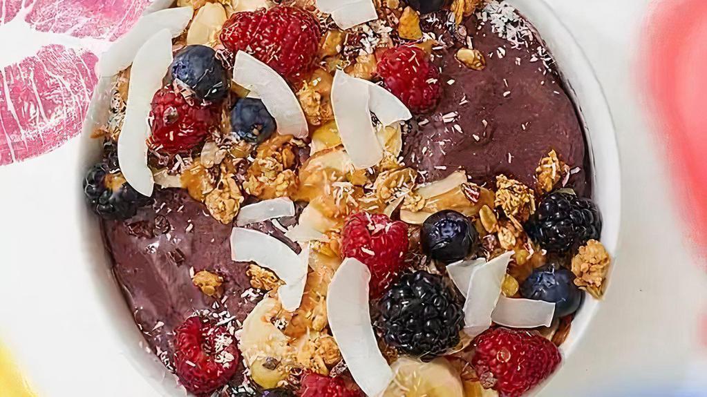 Boo Berry Acai Bowl · Delicious acai blend with granola, honey, blueberries, strawberries, and banana slices.