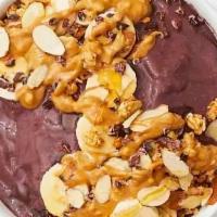 Sweet Baby Acai Bowl · Delicious acai blend with granola, bananas, almond slices, and honey.