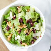 Miriam Salad · Craisins, walnuts, feta cheese and Asian sesame dressing.