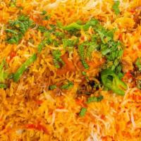 Chicken Biryani · A classic mughlai specialty made with basmati rice cooked with chicken.