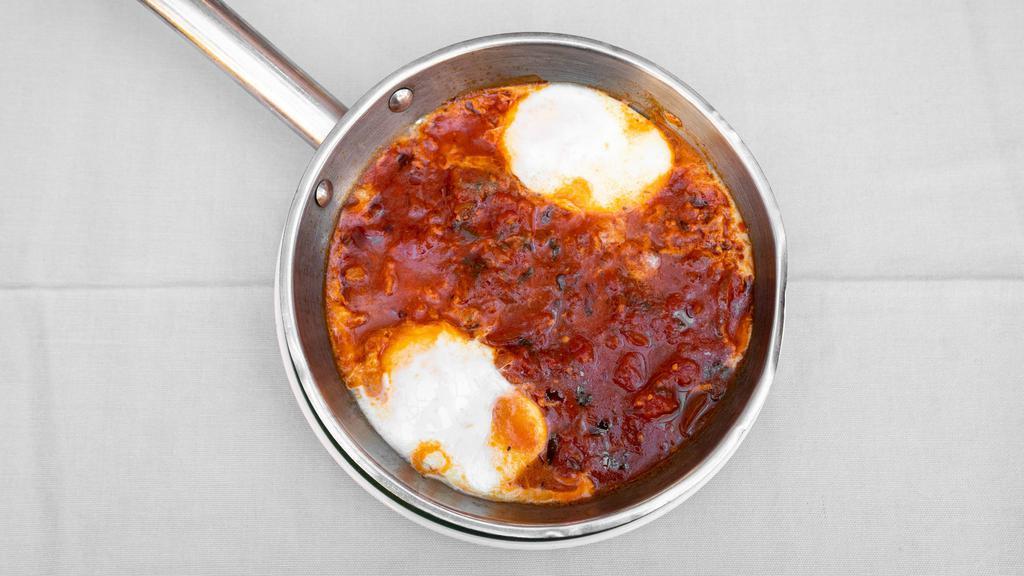 Shakshuka · Gluten free. Tomato stew, peppers and two eggs. Option of whole wheat or regular pita.