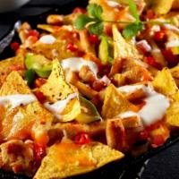 Nachos · Tortilla chips with melted cheese, salsa, and sour cream.