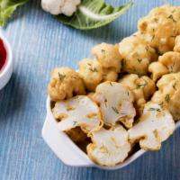 Battered Cauliflower · Fresh cauliflower dipped in batter and fried to perfection.