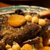 Lamb Tagine
 · Braised lamb shank with prunes, chickpeas and vegetables,
served with couscous