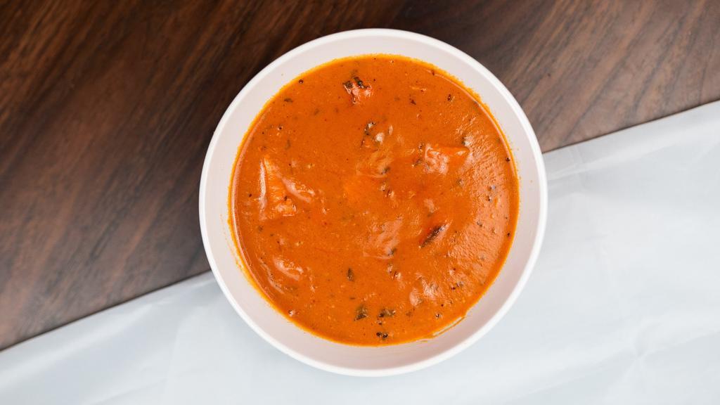 Chicken Tikka Masala · Tender boneless pieces of chicken broiled in the tandoor then cooked in a rich tomato, onion, and cream sauce.