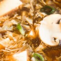 Hot & Sour Soup · spicy soup with tofu ,mushroom,bamboo,egg and carrot.