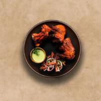 Old Delhi Chicken Tandoori · Chicken marinated in yogurt and herbs roasted in a traditional Indian clay oven.