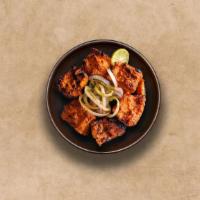 Old Delhi Chicken Tikka  · Tender pieces of chicken marinated with herbs and yogurt, glazed in a traditional Indian cla...