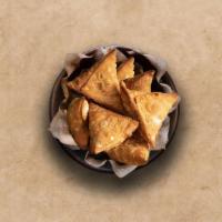 Traditional Vegetable Samosa (2 Pcs) · 2 Pieces perfectly fried crispy pastry dumplings filled with a mix of aromatic herbs and mas...