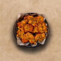 Veggie Pakoras  · 6 Pieces perfectly fried assortment of battered farm-fresh vegetables and herbs.
