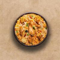 Spice Lane Chicken Biryani · Long grain basmati rice cooked with tender chicken and aromatic Indian herbs. Served with ra...