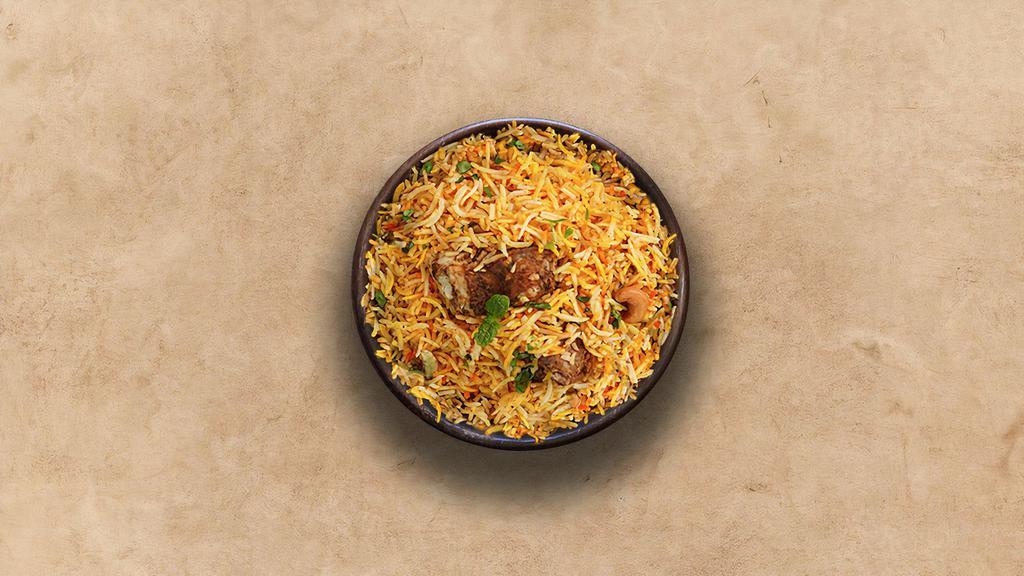 Spice Lane Lamb Biryani · Long grain basmati rice cooked with tender lamb and aromatic Indian herbs. Served with raita.