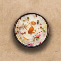 Rice Kheer  · Traditional Indian rice dessert with basmati rice, whole milk, sugar, nuts, and cardamom slo...