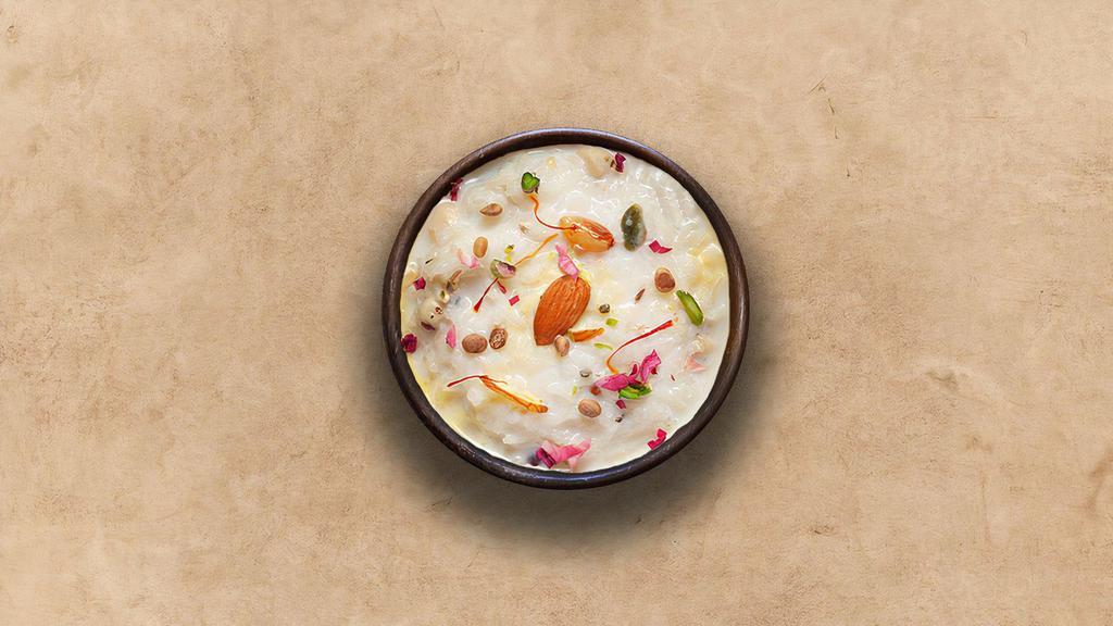 Rice Kheer  · Traditional Indian rice dessert with basmati rice, whole milk, sugar, nuts, and cardamom slow-cooked to perfection.