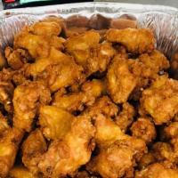 Buffalo Wings · Cooked wing chicken coated in sauce or seasoning.