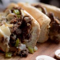 Philly Cheese Steak Hero · Includes peppers, mushrooms and onions.