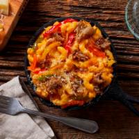 Philly Mac And Cheese · Elbow noodles with a rich mac and cheese sauce, chopped steak, and sauteed onions and peppers.