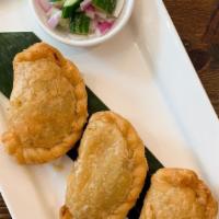 Curry Puffs   · Chicken, curry powder, onion and potato.