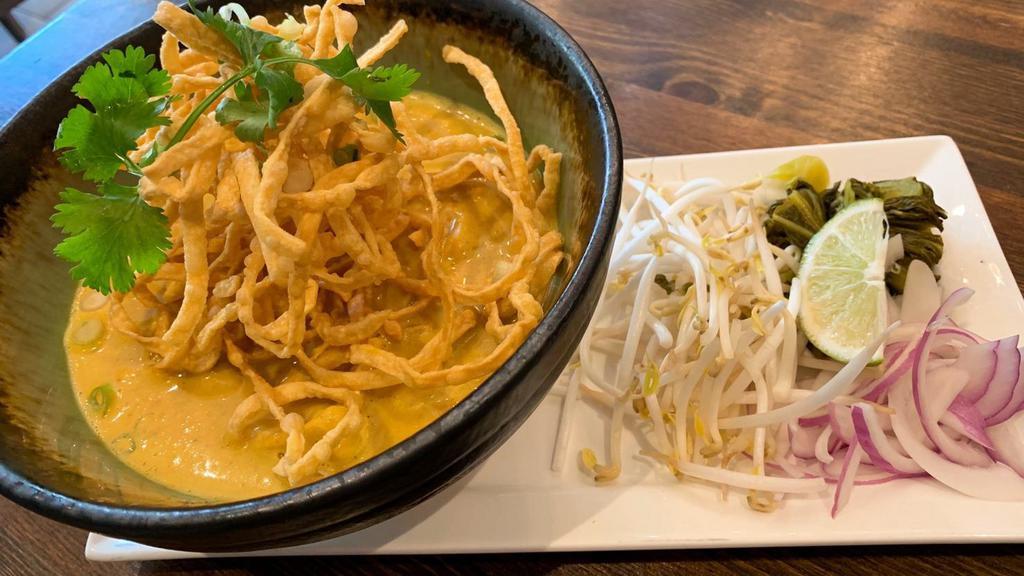Chilang Mai Noodle · Egg noodle, red onion, scallion, crispy noodle on top and picked mustard.