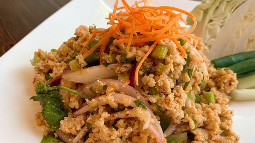 Larb Gai · Ground chicken, red onion scallion, rice powder with chili lime dressing.