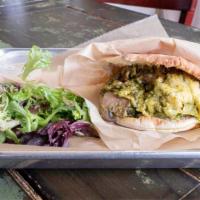 El Guapo · Scrambled egg and cheese mixed with salsa Verde, mushrooms and smashed avocado stuffed in pi...