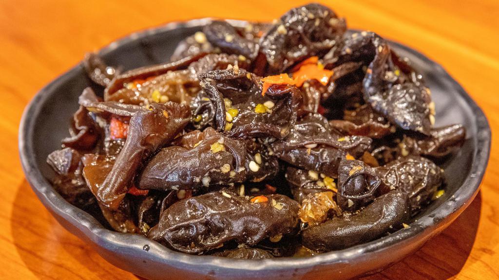 Spicy Black Fungus · Black fungus, seasoned with vinegar, garlic, thai chili, and pickled red chili. Served cold.