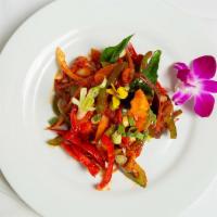 Andhra Chili Chicken · Spicy. Chicken strips tossed with bell pepper, onion, chili, soy sauce and curry leaves.