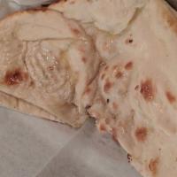 Plain Naan · Unleavened bread cooked in tandoor.