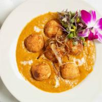 Malai Kofta · Vegetable and paneer cheese rounds in a creamy sauce.