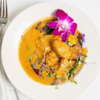 Kori Gassi · Chicken slow-cooked in a coconut, red chili, spices, and star anise.