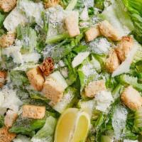 Caesar Salad · Romaine lettuce, bacon, croutons, grated cheese and Caesar dressing.
