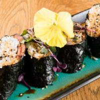 Spam Musubi · Pan seared spam, sushi rice rolled in seaweed, scallions, and eel sauce.