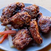 Honey Sriracha Wings (6 Pieces) · Deep fried then tossed in a sweet and spicy sauce. Served with Truffle Ranch and Pickled Veg...