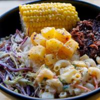 Khalua Pork Dinner · Slow roasted kalua pork with, rice, mac salad, and Coleslaw