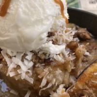 Monkey Bread · Hawaiian kings bread pudding topped with candied pecans and caramel, caramelized banana, and...