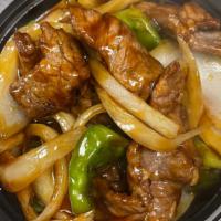 Pepper Steak With Onion · With white rice.