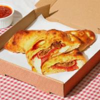 The Barclays Calzone · Calzone with sausage, pepperoni, bacon, melted mozzarella, and a side of marinara.