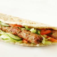 Shish Kebab Sandwich · Juicy, tender, char-broiled filet mignon pieces. Wrapped in a warm pita and topped with fres...