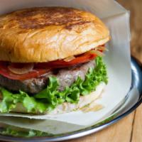 Lebanese Style Lamb Burger · Juicy, ground lamb and spice burger, grilled to perfection, and topped with fresh tomatoes, ...